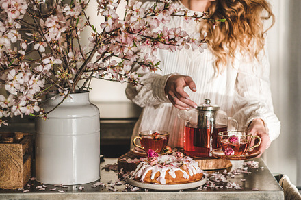 Young woman serving homemade bundt, a Food & Drink Photo by Foxys