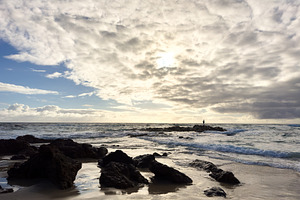 Fisherman On Rocks Silhouette, a Nature Photo by THP Creative