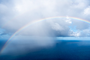 Rainbow over the ocean near Tahaa island, French Polynesia, a Nature Photo by GoodGoods