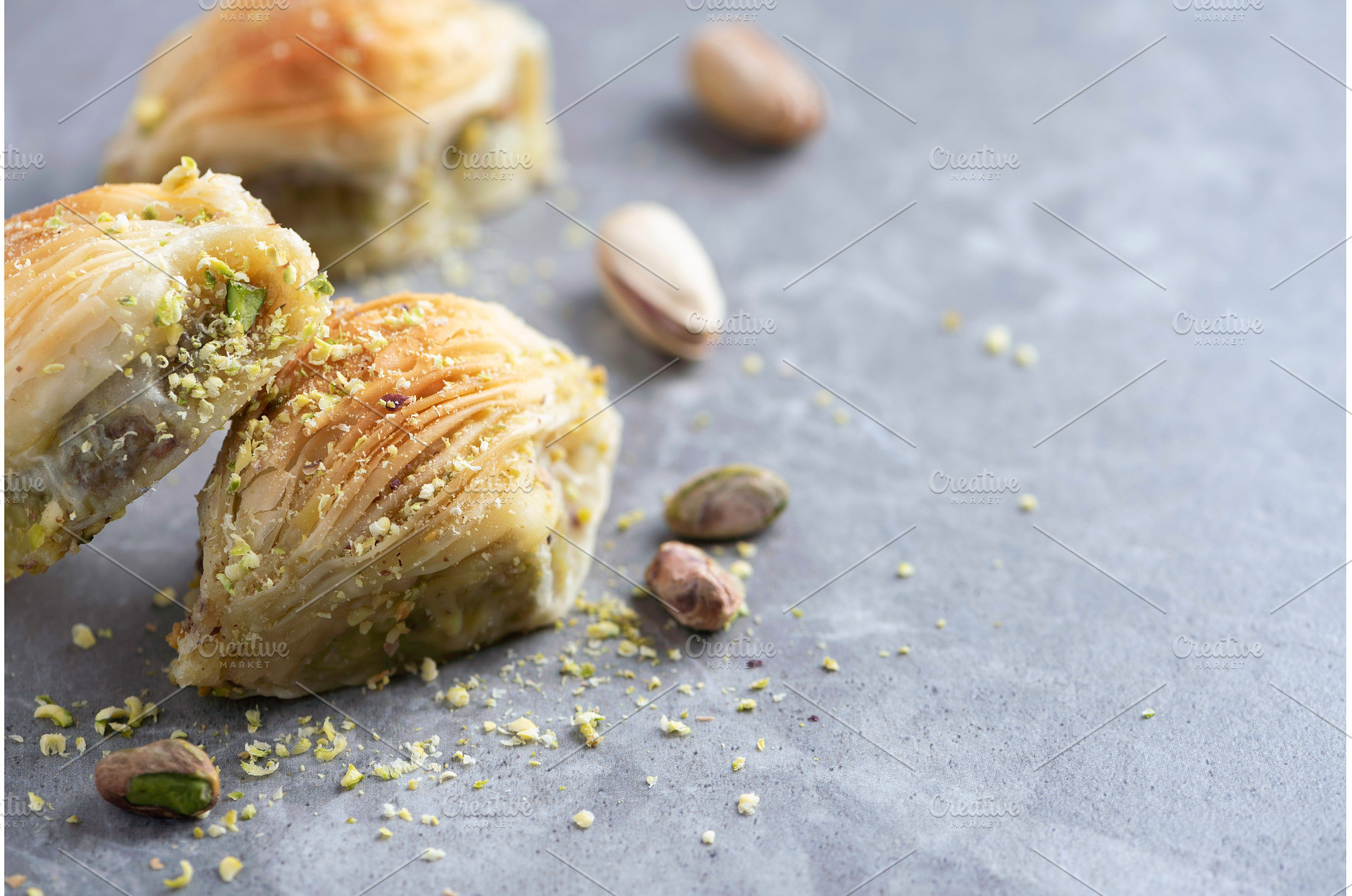 Baklava with pistachios on grey, a Food & Drink Photo by Enjoy Photo