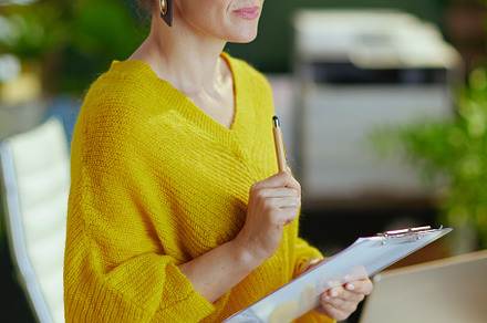trendy business owner woman in sweater in green office, a Business Photo by Alliance Images