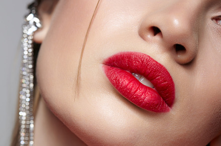 Close-up portrait of young woman in red dress and red rose in ha, a Beauty & Fashion Photo by Zastavkin