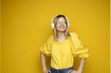 Blonde woman in a glasses and yellow, a Person Photo by volodymyrshtun13795