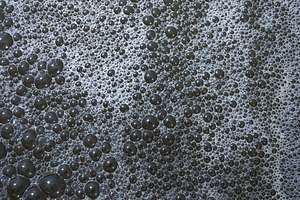 Close-Up of Soap Bubbles Forming Abs, an Abstract Photo by bastera