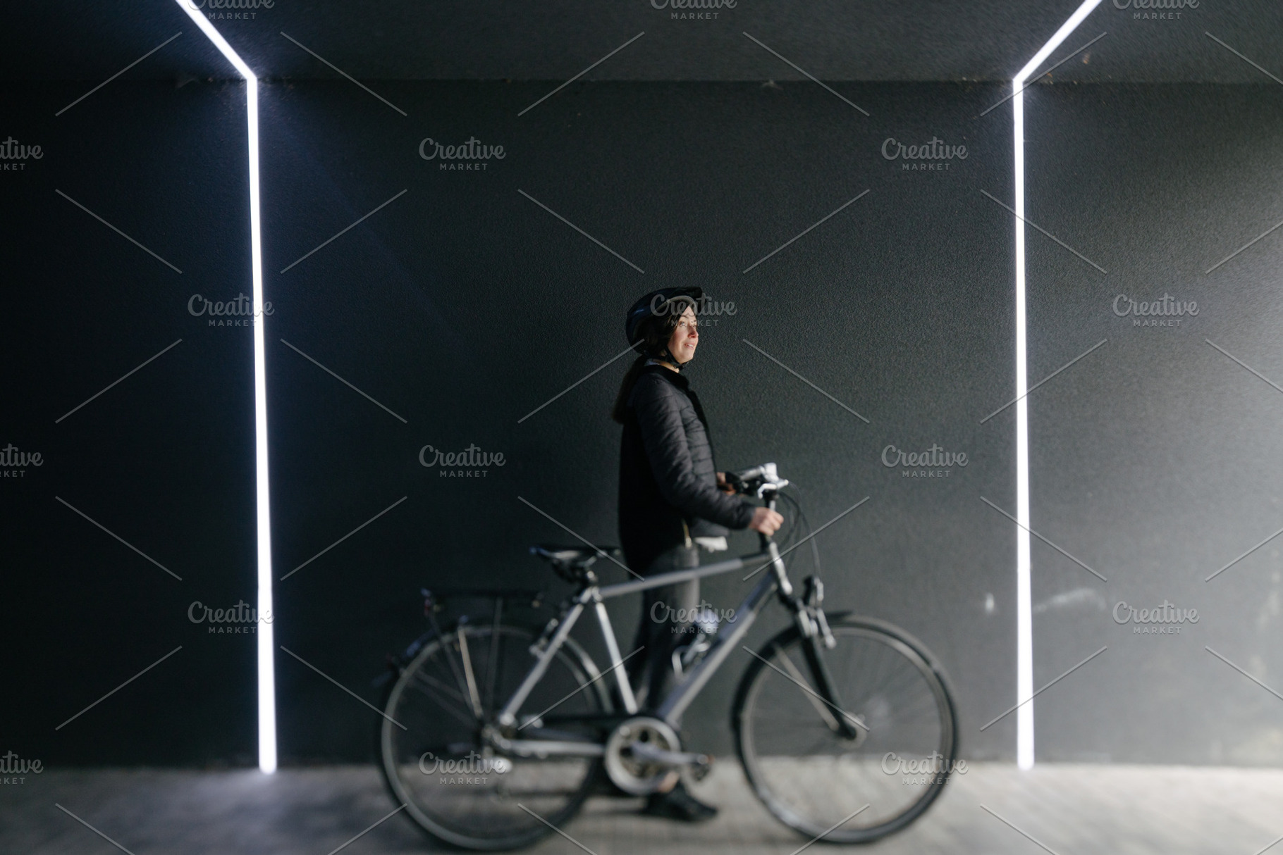 Woman riding a bicycle in a city, a Sports & Recreation Photo by 5max
