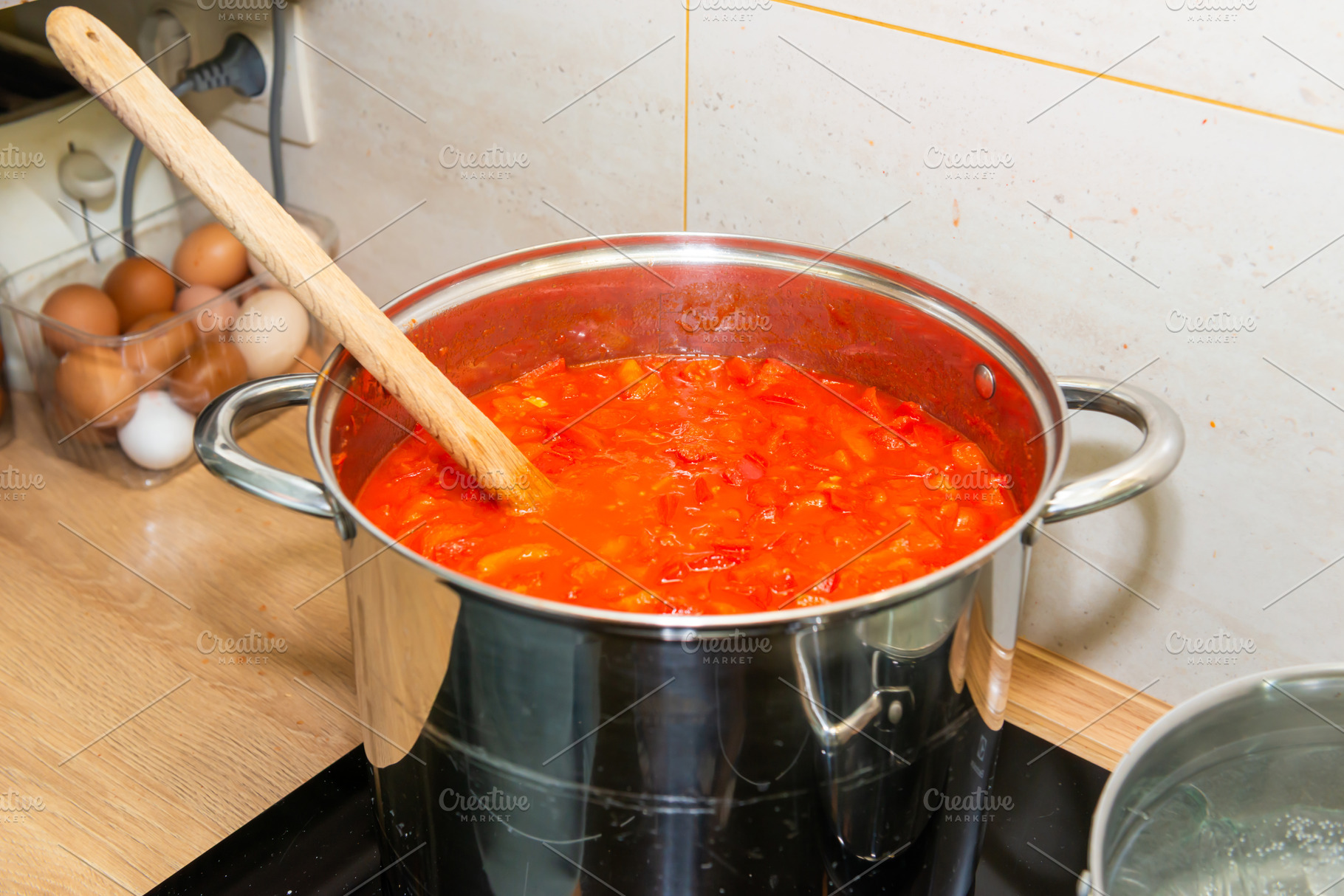 Tomato sauce in big cooking pot, a Food & Drink Photo by Vapi