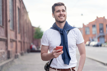 Handsome man listening to music, a Person Photo by OPOLJA