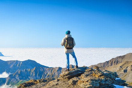 Tourist with a backpack in the mount, a Person Photo by Landscape and travel