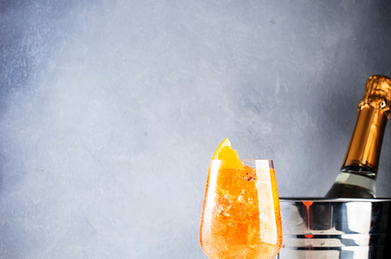 Aperol spritz classic alcoholic cocktail in wine glass, summer I, a Food & Drink Photo by 5PH