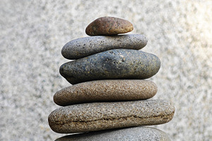 Stacked stones in perfect balance, symbolizing meditation, a Photo by salmon.black