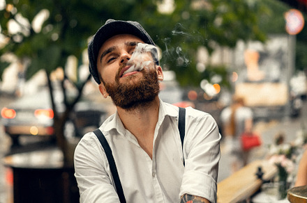 Young bearded man in a cafe, a Person Photo by EVA.studio