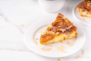 Traditional French almond cake with frangipane and apricots, a Food & Drink Photo by Rimma
