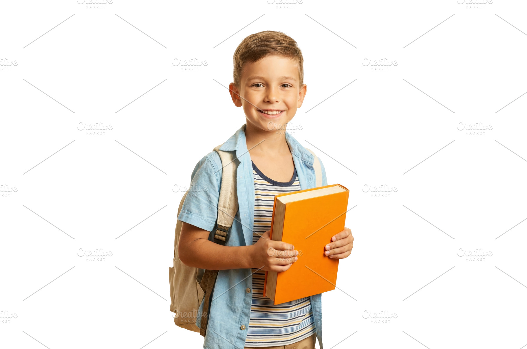 Boy Holding a School Book, a School & Education Photo by CREATIVEDEF