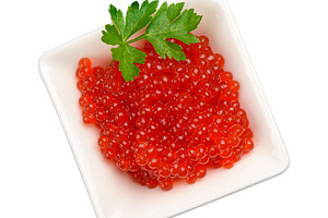 Red caviar in a white square ceramic bowl decorated with a sprig, a Food & Drink Photo by ndanko