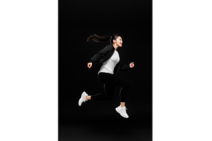Asian woman in athletic clothing, a Person Photo by Sergey Kotenev
