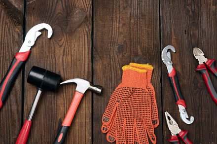 A set of construction tools on a brown wooden background, top vi, an Industrial Photo by ndanko