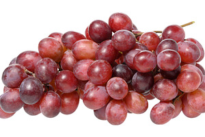 Bunch of ripe, red grapes, isolated  background. The grapes are, a Food & Drink Photo by ndanko