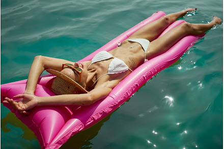 Summer Bikini woman on inflatable