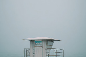 Empty lifeguard tower against sea, an Architecture Photo by Virgo Studio