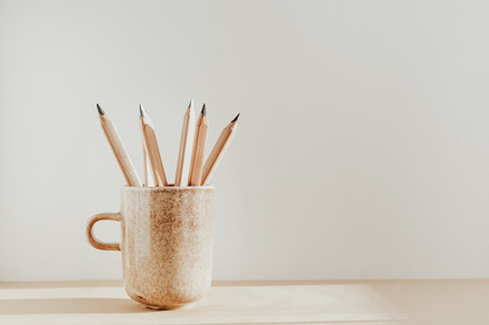 Pencils in a ceramic mug on a table featuring pencil, draw, and desk, an Arts & Entertainment Photo by Edalin's Store