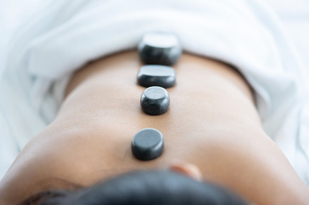 Asian Woman Have a Hot Stone Massage