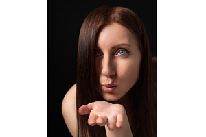 Woman blowing lips send air kisses, a Person Photo by Alexander-Piragis