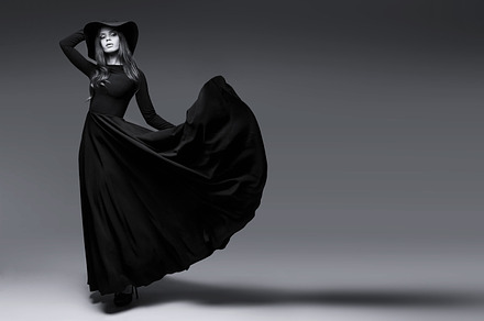 Elegant woman in long black dress featuring black, white, and hat, a Beauty & Fashion Photo by MaxFrost