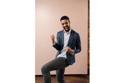 Happy young succeeful businessman, a Person Photo by HalfPoint