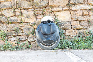 Black Electric unicycle and a white