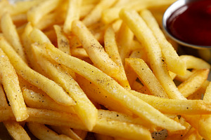 Homemade French Fries and Ketchup on a Plate, low angle view. Cl, a Food & Drink Photo by LiudmylaChuhunova