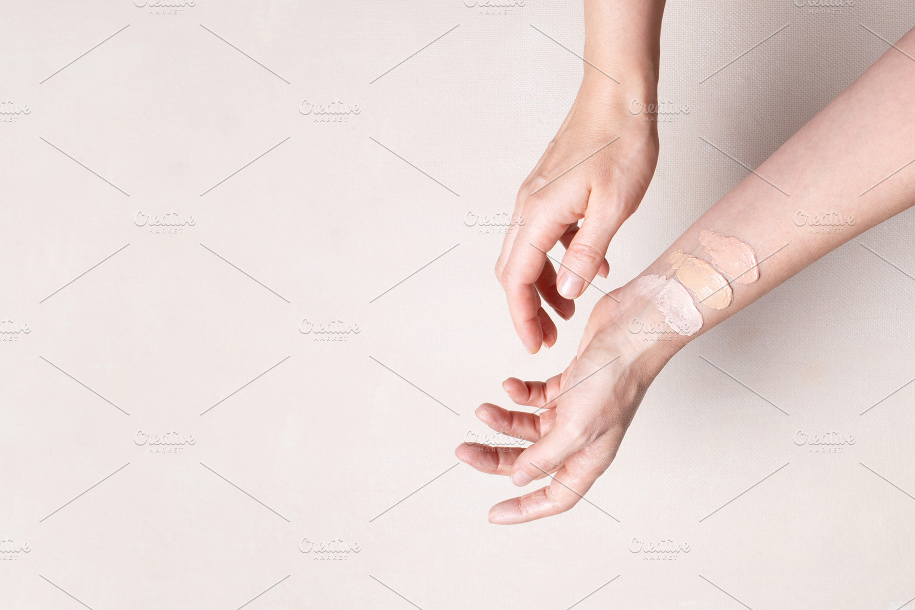 Female hands with makeup foundation, a Beauty & Fashion Photo by AlinaKho