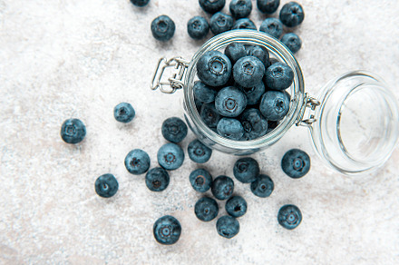 Blueberries on concrete background, a Food & Drink Photo by Olena Rudo