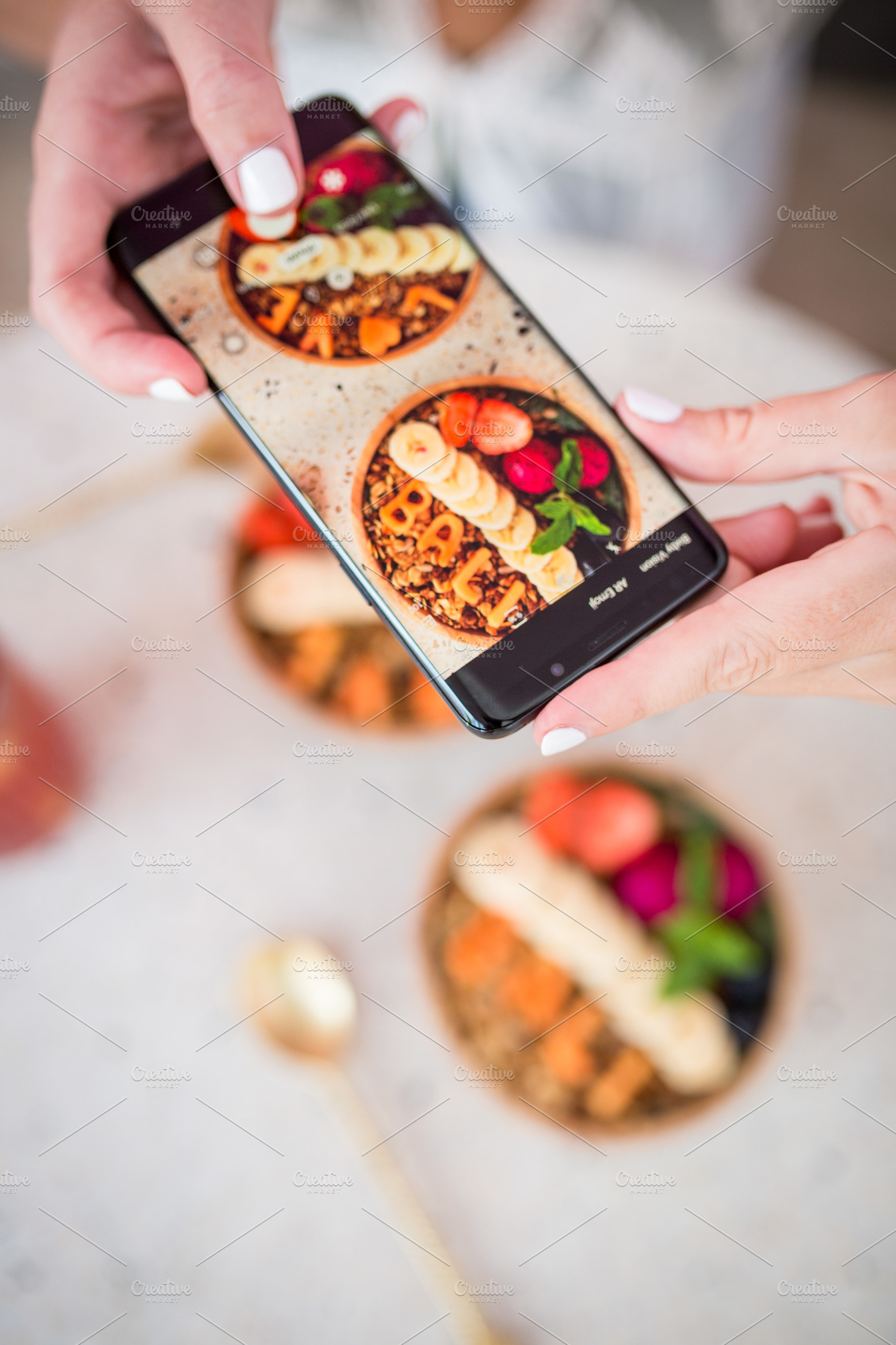 Female hands taking a photo, a Food & Drink Photo by Beach Babe Stock
