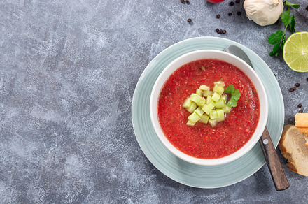 Soup Gazpacho garnished with cucumber and cilantro, in bowl, horizontal top vie, a Food & Drink Photo by iuliia_n