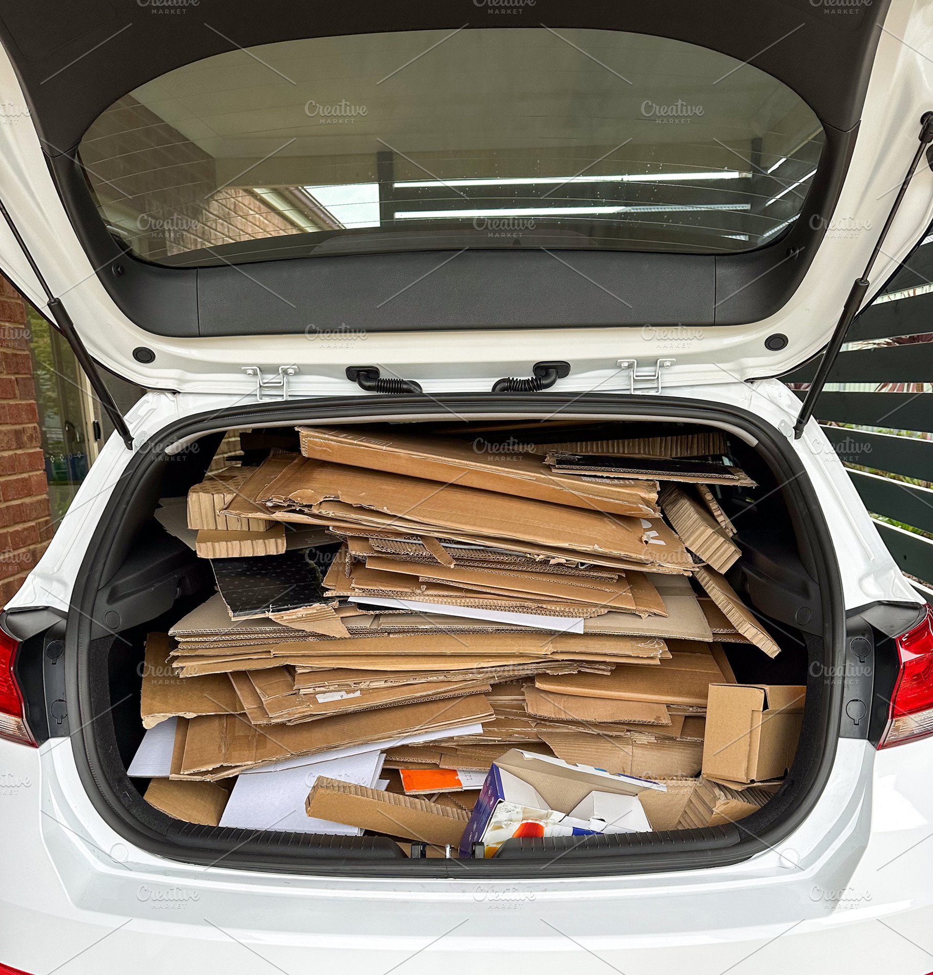 Taking Cardboard To Be Recycled, an Industrial Photo by THP Creative