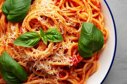 Homemade Pasta Pomodoro on a Plate, top view. Flat lay, overhead, a Food & Drink Photo by LiudmylaChuhunova