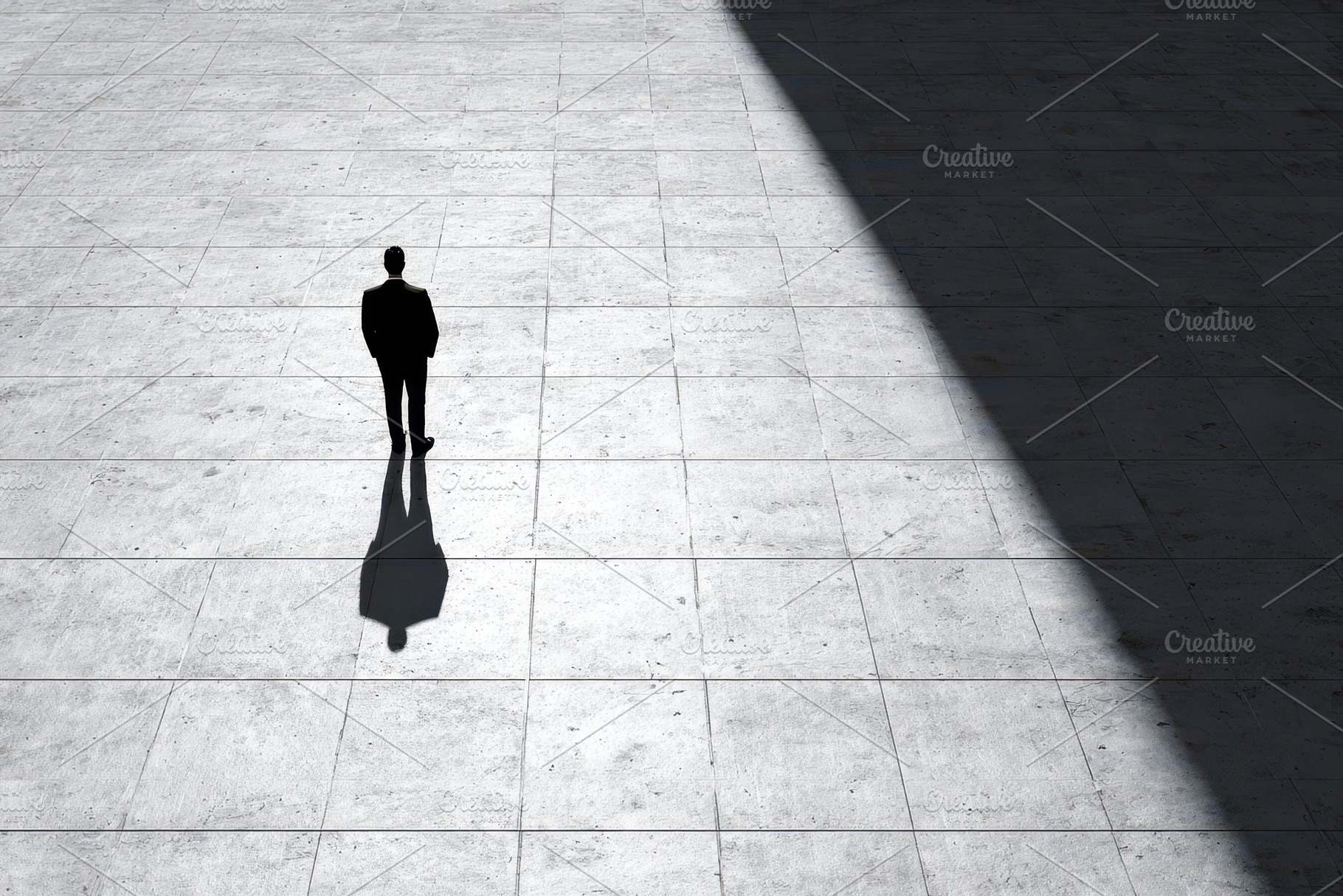 Man stands alone in a large, a Photo by Pavel_design