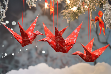 Three red origami cranes hanging from a snowy tree, decorated with white snowfl, an Arts & Entertainment Photo by Textures & Backgrounds