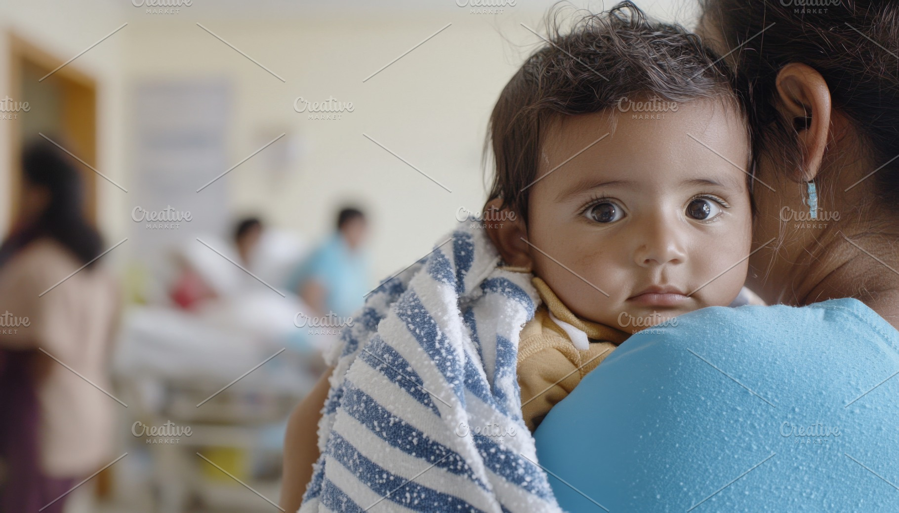 Latin american baby held by woman in, a Photo by Dvoevnore photos