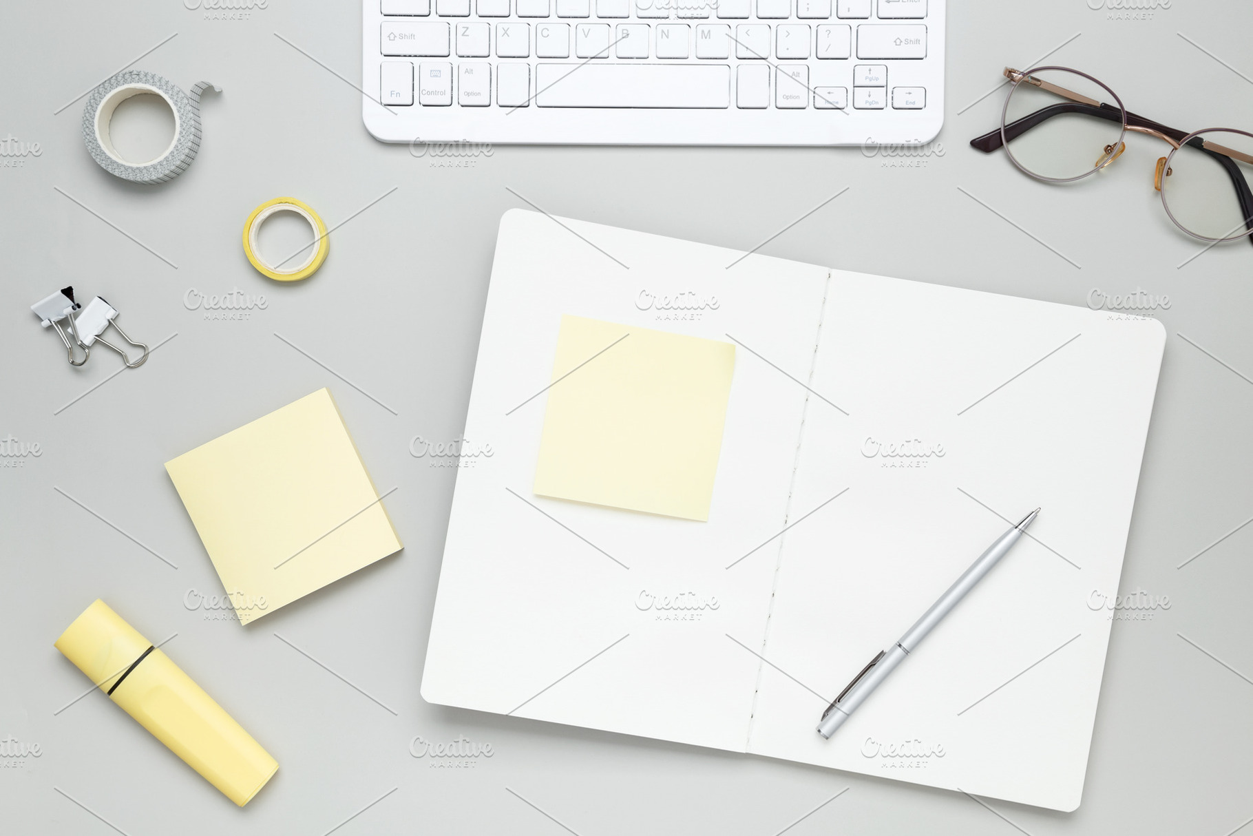 Organized workspace with stationery, keyboard, glasses and notebook creating pr, a Photo by matucha