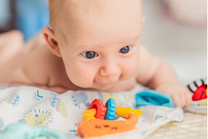 Adorable baby playing with colorful, a Person Photo by Elizaveta Galitskaya