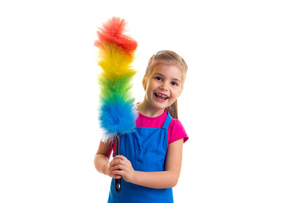 Girl in apron with duster doing featuring apron, background, and casual