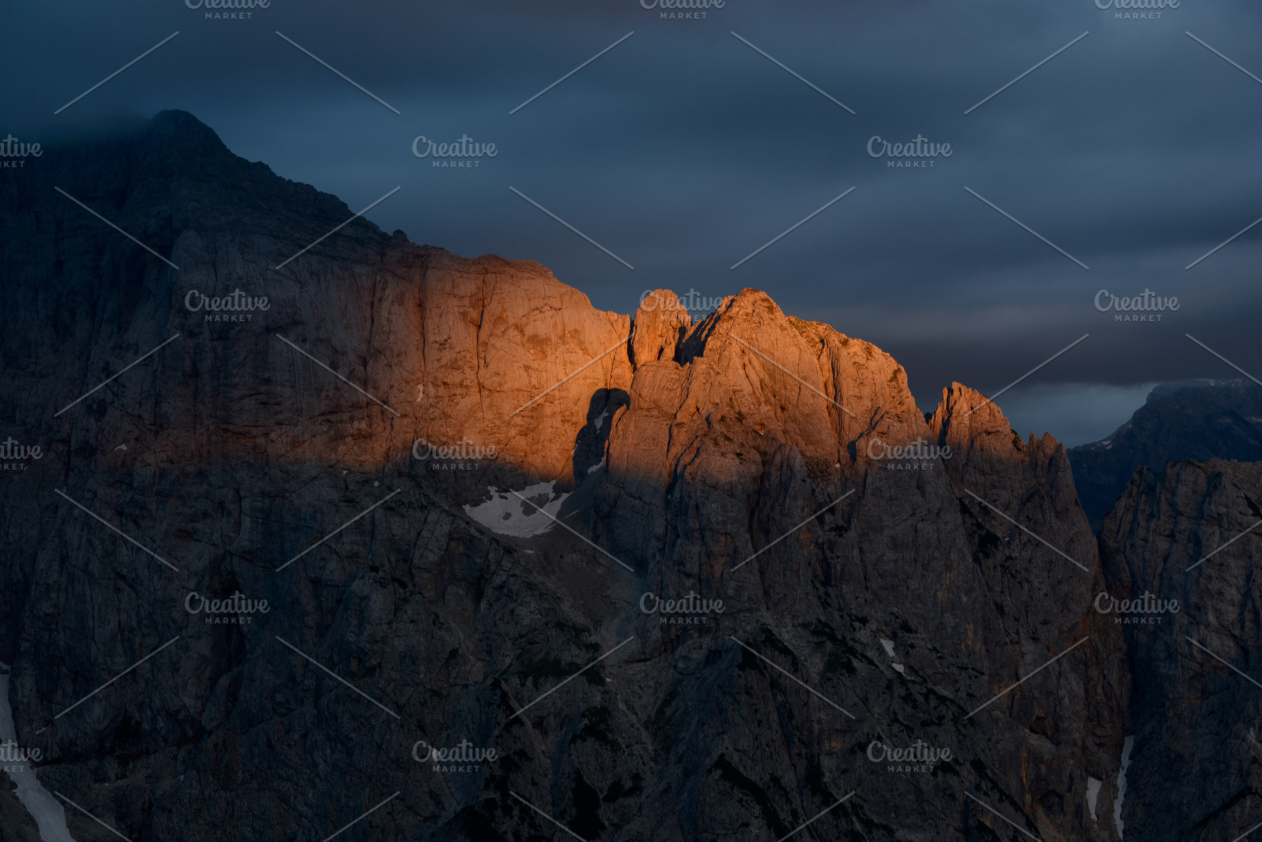 Sunset over the peaks of the mountai, a Nature Photo by Dreamy Pixel