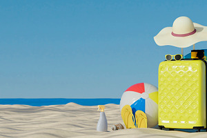 Summer beach luggage with vacation accessories and ball, a Holiday Photo by RF Images