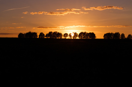 Evening landscape with silhouettes o containing sunset, landscape, and evening, a Nature Photo by oleghz