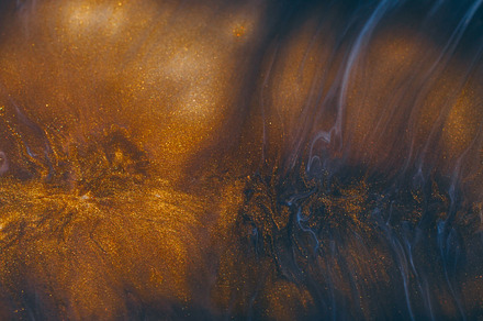 Sparkling paint golden fluid liquid splash texture