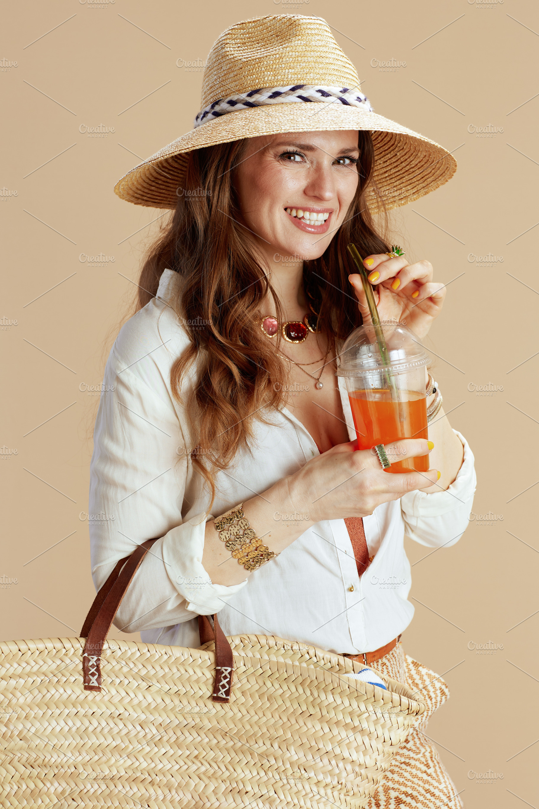 happy elegant 40 years old woman in blouse and shorts on beige, a Person Photo by Alliance Images