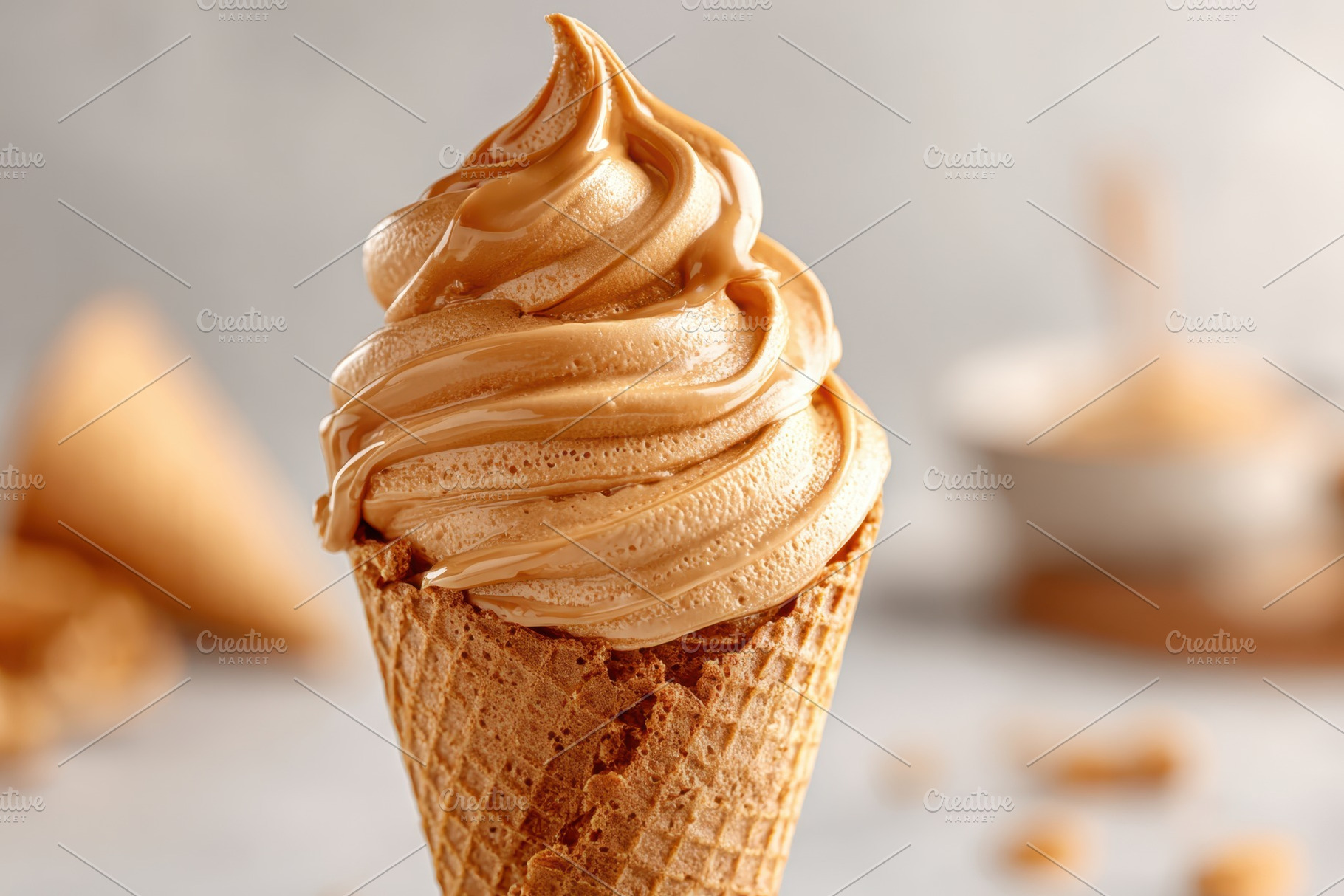 Caramel ice cream in waffle cone, a Food & Drink Photo by AlyaAnd