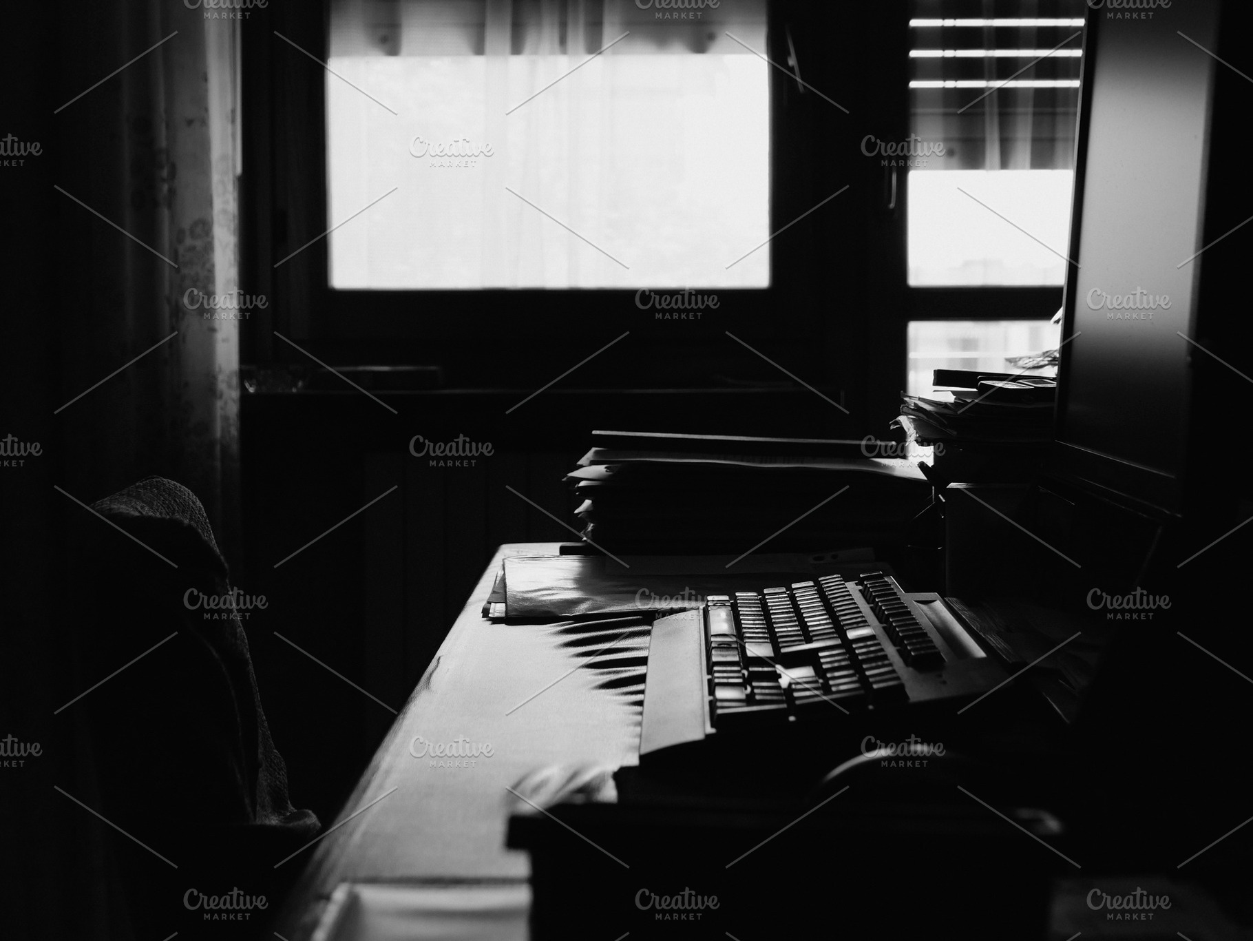 office with desktop pc in bw, a Photo by WorldOfPhotos