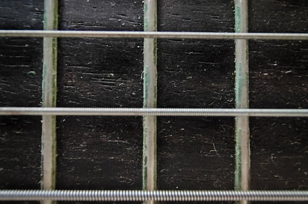 Close-up, high-angle detail shot of a classic spanish guitar, an Arts & Entertainment Photo by DanFLCreativo